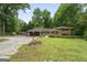Charming two-story brick home with a well-manicured lawn and an attached garage at 23 Hunting Creek Dr, Marietta, GA 30068