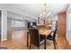 Open living space with hardwood floors, connecting the living room, dining area, and kitchen at 23 Hunting Creek Dr, Marietta, GA 30068