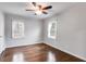 Bedroom featuring hardwood floors, neutral walls, and two windows at 1318 Beecher Sw St, Atlanta, GA 30310