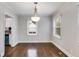 Dining room with hardwood floors, a chandelier, and natural light at 1318 Beecher Sw St, Atlanta, GA 30310