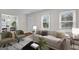 Bright living room featuring neutral walls, refinished hardwood floors, and plenty of natural light at 1318 Beecher Sw St, Atlanta, GA 30310