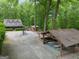 Expansive property featuring a charming home, covered picnic area, and ample parking nestled among mature trees at 68 Edwin Pl, Atlanta, GA 30318