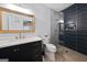 Elegant bathroom boasts a modern vanity, gold fixtures, and a stunning shower with decorative tile and glass door at 68 Edwin Pl, Atlanta, GA 30318