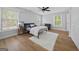 Cozy bedroom with hardwood floors, bright windows, and a plush white rug adding comfort and style at 68 Edwin Pl, Atlanta, GA 30318