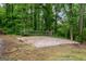 Outdoor sand volleyball court in a wooded area is ready for fun and games at 68 Edwin Pl, Atlanta, GA 30318
