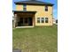 The home features a spacious, grassy backyard with a covered patio at 340 Mcgiboney Ln, Covington, GA 30016