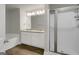 Bright bathroom with a double sink vanity, glass shower and soaking tub at 340 Mcgiboney Ln, Covington, GA 30016