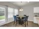 Charming dining area with seating for four and natural light from the rear door at 340 Mcgiboney Ln, Covington, GA 30016