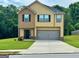 Charming two-story home with a two-car garage and well-maintained front yard at 340 Mcgiboney Ln, Covington, GA 30016