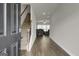 View of the foyer featuring hard surface floors, staircase, and neutral paint at 340 Mcgiboney Ln, Covington, GA 30016