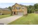 Charming two-story home featuring a two car garage and well manicured lawn at 340 Mcgiboney Ln, Covington, GA 30016
