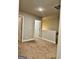 Carpeted hallway leading to bedrooms with neutral colored walls at 340 Mcgiboney Ln, Covington, GA 30016