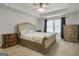 Main bedroom featuring carpeted floors, gray walls, a large bed and a window with curtains at 340 Mcgiboney Ln, Covington, GA 30016