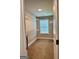 A well-lit walk-in closet provides ample storage space with wire shelving and a window for natural light at 340 Mcgiboney Ln, Covington, GA 30016