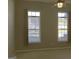 Bedroom featuring a ceiling fan and two bright, sunny windows with blinds at 175 Camry Ln, Grayson, GA 30017