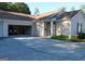 Long driveway leading to a two car garage with red jeep and inviting front entrance at 175 Camry Ln, Grayson, GA 30017