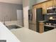 Well-equipped kitchen with stainless steel appliances, modern countertops, and ample storage at 175 Camry Ln, Grayson, GA 30017