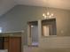Spacious living area with a decorative chandelier and open access to other rooms at 175 Camry Ln, Grayson, GA 30017