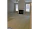 Spacious living room featuring a fireplace, neutral carpet, and bright windows at 175 Camry Ln, Grayson, GA 30017