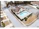 Aerial view of community pool with white fence, landscaping, parking, and covered picnic area at 175 Camry Ln, Grayson, GA 30017