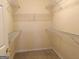 Empty walk-in closet with metal racks for organization at 175 Camry Ln, Grayson, GA 30017