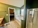 Bathroom featuring a separate shower and soaking tub adjacent to bedroom at 9108 Alden Dr, Locust Grove, GA 30248