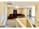 Upstairs bonus room features neutral paint, and a cozy sofa at 9108 Alden Dr, Locust Grove, GA 30248