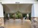 Open-air pavilion with stone columns and ceiling fan for outdoor gathering and relaxation at 9108 Alden Dr, Locust Grove, GA 30248