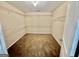 Spacious walk-in closet with ample shelving for optimal organization and storage at 9108 Alden Dr, Locust Grove, GA 30248