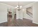 Open-concept dining area with hardwood floors, flowing into the kitchen and living room at 9046 Holder Rd, Locust Grove, GA 30248