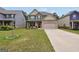 Attractive two-story home with a manicured lawn, showcasing a brick and siding exterior design at 9046 Holder Rd, Locust Grove, GA 30248