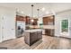 Modern kitchen with stainless steel appliances, granite countertops, and an island at 9046 Holder Rd, Locust Grove, GA 30248