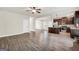 Open concept kitchen and living room design with wood floors at 9046 Holder Rd, Locust Grove, GA 30248