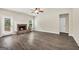 Spacious living room featuring access to fireplace and doorway on the left side at 9046 Holder Rd, Locust Grove, GA 30248