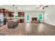 Open concept living space with a brick fireplace and an adjacent kitchen at 9046 Holder Rd, Locust Grove, GA 30248