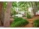 Lush backyard featuring a pool and outdoor dining area at 110 Orchard Vw, Fayetteville, GA 30215