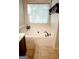 Relaxing bathroom featuring a soaking tub under a window at 110 Orchard Vw, Fayetteville, GA 30215