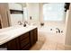 Bathroom featuring a soaking tub, double sinks, and a large vanity offering a serene spa-like retreat at 110 Orchard Vw, Fayetteville, GA 30215
