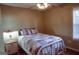 Charming bedroom with a white iron bed frame and vintage nightstand at 110 Orchard Vw, Fayetteville, GA 30215