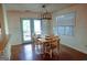 Bright dining area featuring a wooden table, light-colored chairs, and blue-framed doors at 110 Orchard Vw, Fayetteville, GA 30215