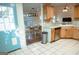 An open kitchen with oak cabinets, stainless appliances and an adjacent dining area enhance the home's appeal at 110 Orchard Vw, Fayetteville, GA 30215