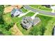 Aerial view of a beautiful home on a large lot with mature trees at 120 Lapis Lake Pt, Fayetteville, GA 30215