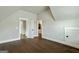 Attic room features hardwood floors and multiple doorways at 120 Lapis Lake Pt, Fayetteville, GA 30215