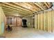 Spacious unfinished basement features exposed framing and a treadmill at 120 Lapis Lake Pt, Fayetteville, GA 30215