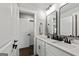 Modern bathroom with double vanity, matte black fixtures and white cabinetry at 120 Lapis Lake Pt, Fayetteville, GA 30215