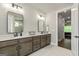 Spacious bathroom boasts double vanity, modern fixtures, and bright lighting at 120 Lapis Lake Pt, Fayetteville, GA 30215