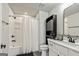Bathroom featuring white subway tile, dark fixtures, and white vanity at 120 Lapis Lake Pt, Fayetteville, GA 30215