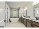 Spa-like bathroom features a standalone tub, double vanity, and modern fixtures at 120 Lapis Lake Pt, Fayetteville, GA 30215