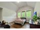 Cozy bedroom with vaulted ceiling, hardwood floors and decor at 120 Lapis Lake Pt, Fayetteville, GA 30215