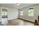 Bright room featuring hardwood floors, neutral paint and large windows at 120 Lapis Lake Pt, Fayetteville, GA 30215